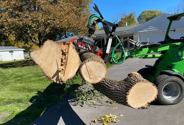 Avanat tree trunk removal vehicle in action.