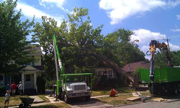 Storm damage clean-up after a tree falls onto a home.