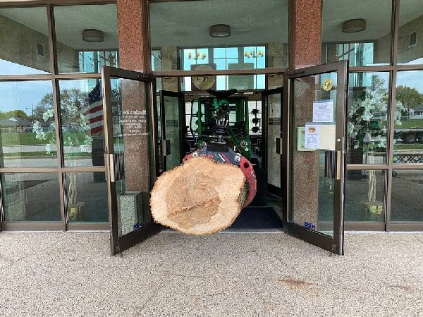 Difficult tree removal through church